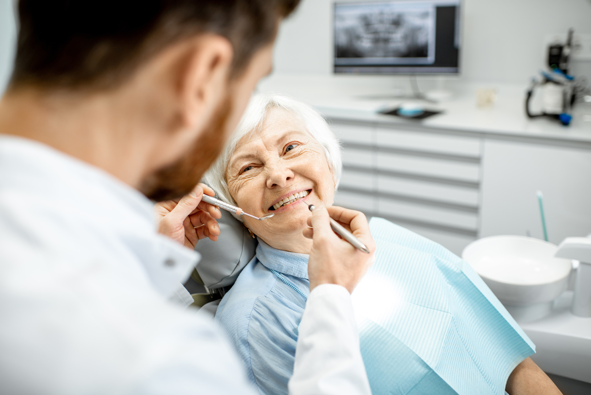 Elderly woman during the medical examination with dentist